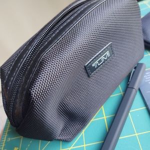 Two unused Delta One Tumi amenity kits